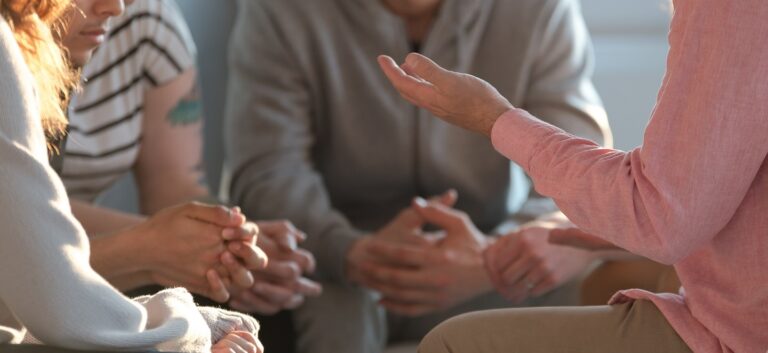 Close-up,Of,A,Therapist,Gesticulating,While,Talking,To,A,Group